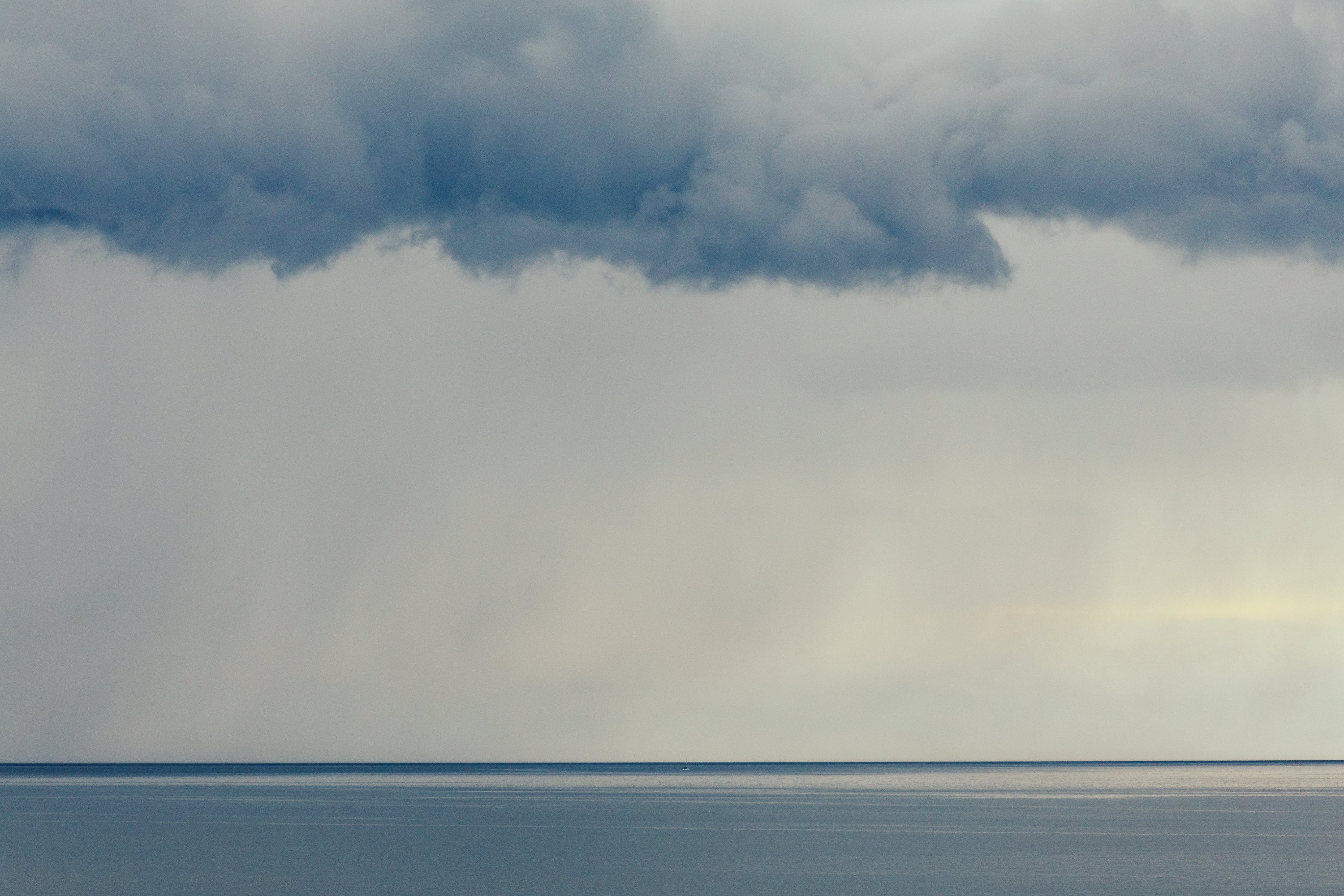 Horizon line with a large cloud formation above it